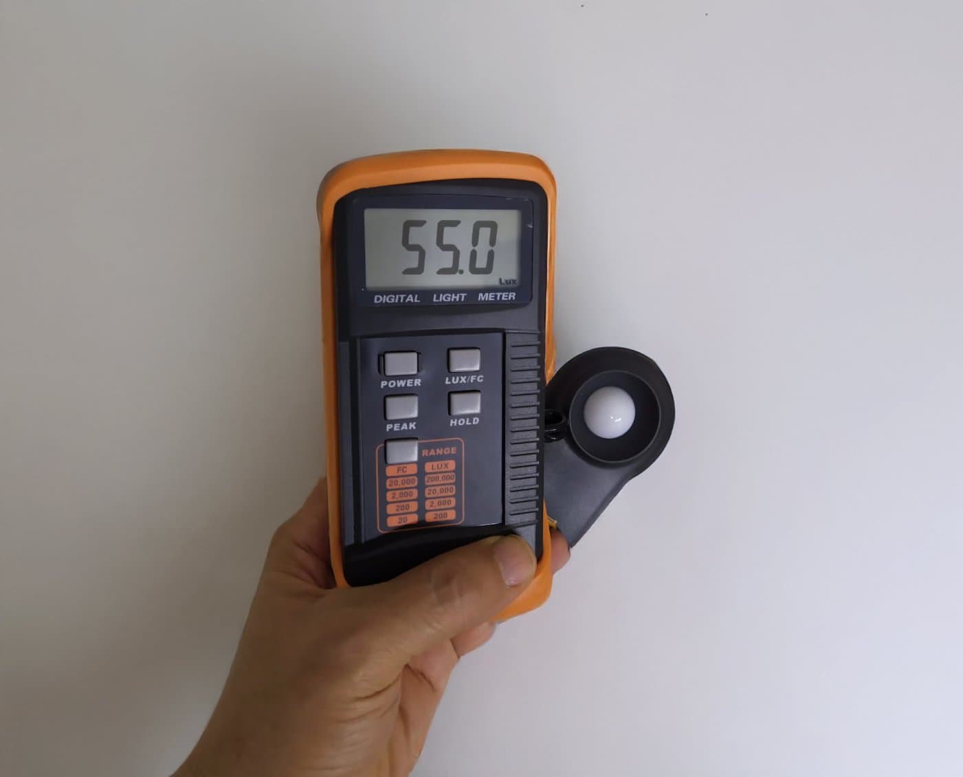Luxmeter reading 55 lux from 48V white LED strip in mining tunnel